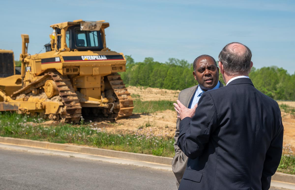 Erran Persley with the Kentucky Cabinet of Economic Development discusses the build-ready pad with RCIDA Executive Director Bennie Garland at the Lake Cumberland Regional Industrial Complex Build-Ready Pad  construction site.