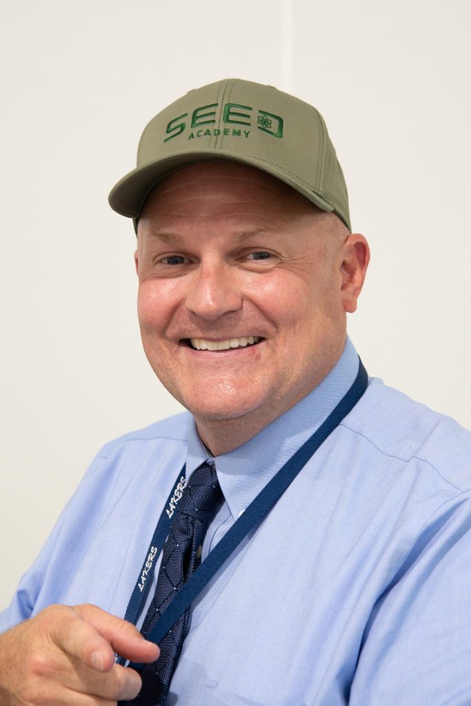man wearing SEED Academy cap
