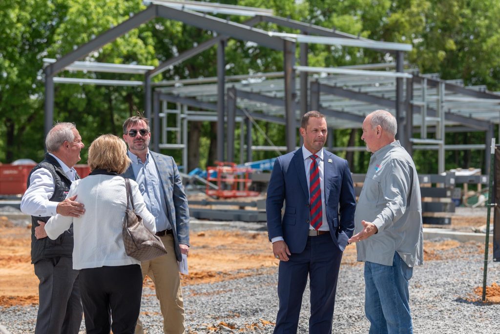 people talking at construction site