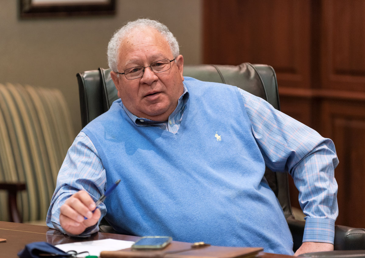 Gene Smith in a board meeting